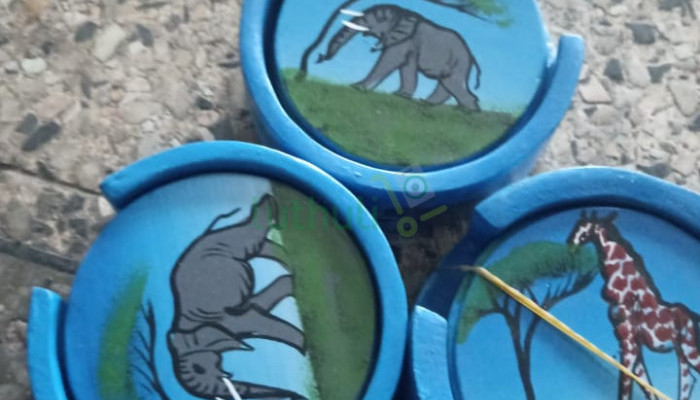 Hand-painted soapstone animal coasters in blue holder